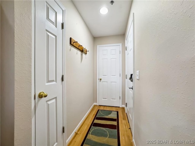 entryway with light hardwood / wood-style flooring