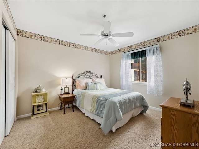 carpeted bedroom with a closet and ceiling fan