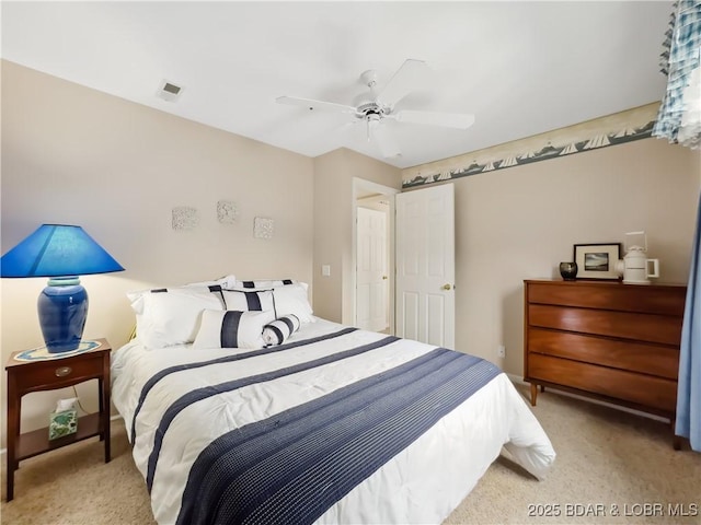 carpeted bedroom featuring ceiling fan