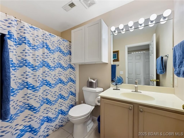 bathroom featuring tile patterned floors, toilet, and vanity