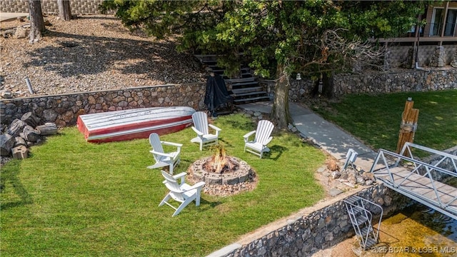 view of yard with an outdoor fire pit