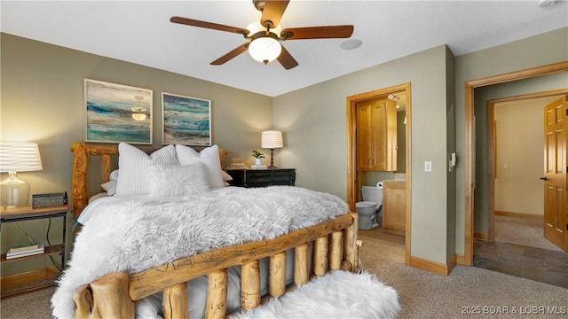 bedroom with carpet, connected bathroom, and ceiling fan