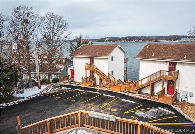 back of property with a water view