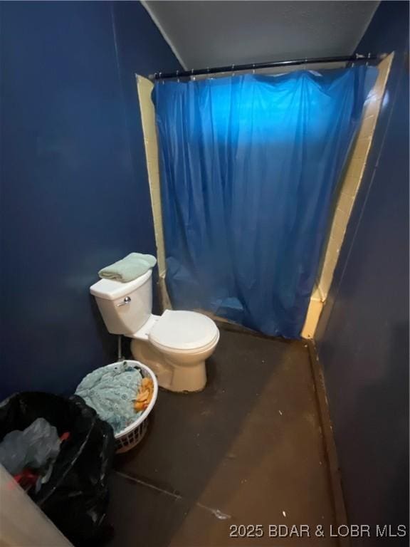 23417 Hwy Tt, Versailles, MO 65084 - bathroom with toilet, a stall shower, and concrete flooring