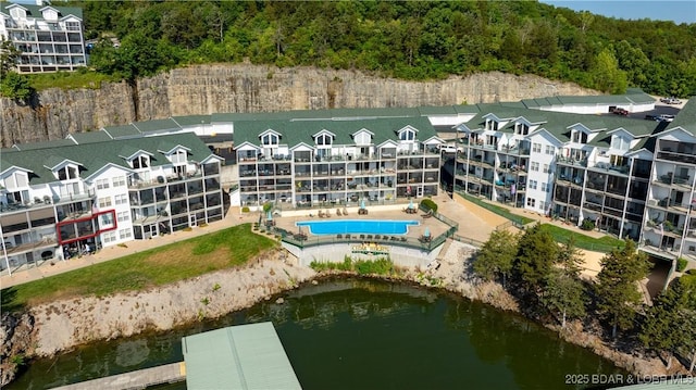 316 Cedar Heights Dr Unit 2C, Camdenton, MO 65020 - drone / aerial view of apartment complex / building, a pool area, and a nearby body of water