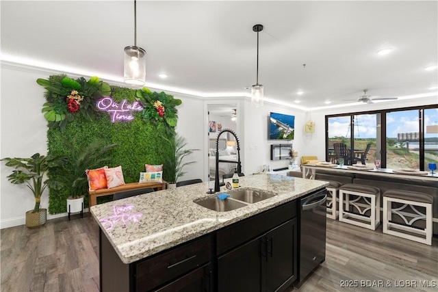1065 Topsider Ln Unit 408, Osage Beach, MO 65065 - kitchen featuring a sink, stainless steel dishwasher, ornamental molding, pendant lighting, and dark wood-style floors