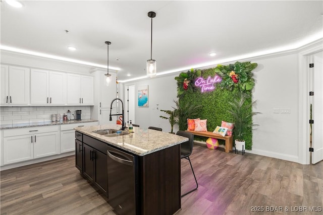 1065 Topsider Ln Unit 408, Osage Beach, MO 65065 - kitchen with a sink, stainless steel dishwasher, backsplash, white cabinetry, and wood finished floors