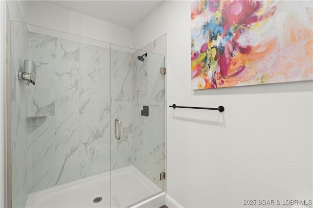 1065 Topsider Ln Unit 408, Osage Beach, MO 65065 - bathroom featuring a marble finish shower and baseboards
