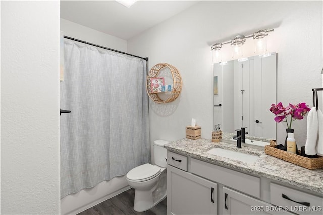 1065 Topsider Ln Unit 408, Osage Beach, MO 65065 - full bath with vanity, toilet, wood finished floors, and shower / bath combo