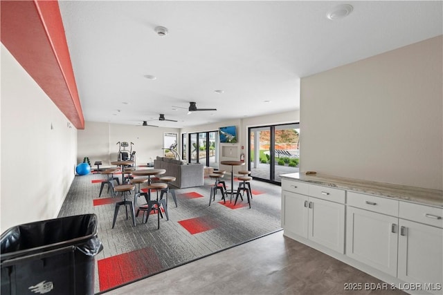 1065 Topsider Ln Unit 408, Osage Beach, MO 65065 - dining area with a ceiling fan and finished concrete flooring