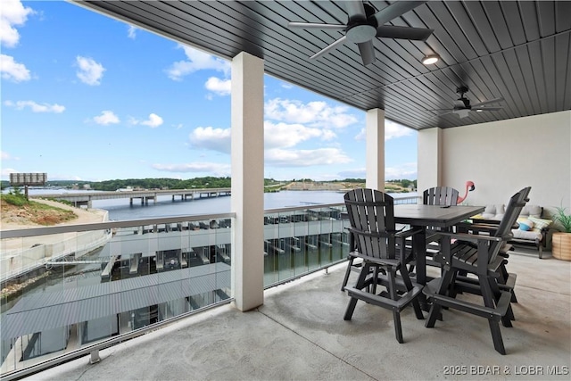 1065 Topsider Ln Unit 408, Osage Beach, MO 65065 - view of patio / terrace with a ceiling fan, a water view, and a balcony