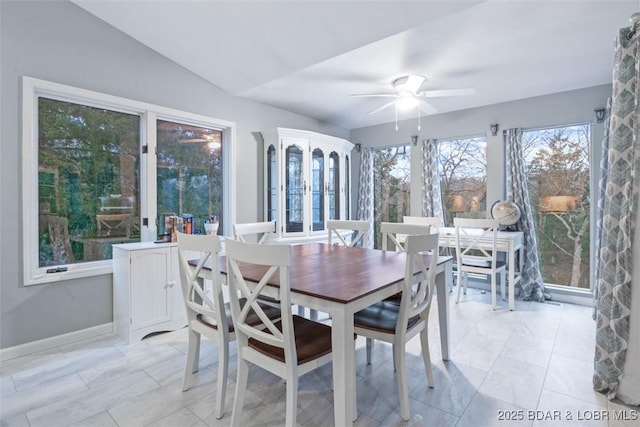 sunroom with vaulted ceiling and ceiling fan