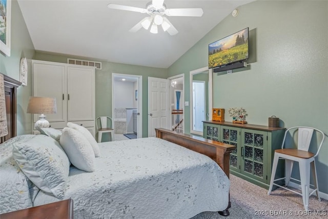 carpeted bedroom with a ceiling fan, visible vents, vaulted ceiling, and connected bathroom