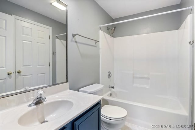 full bathroom featuring toilet, bathtub / shower combination, and vanity