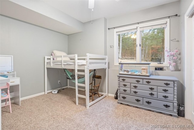 carpeted bedroom with baseboards