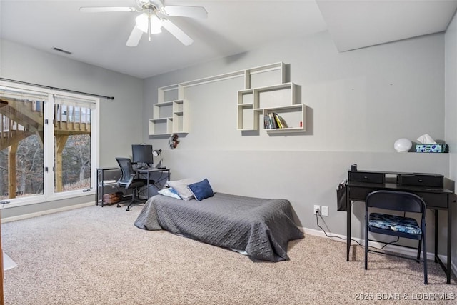 carpeted bedroom featuring a ceiling fan, visible vents, and baseboards