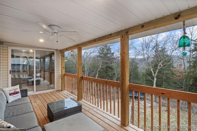 wooden deck featuring a ceiling fan