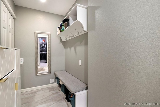 mudroom featuring marble finish floor and baseboards