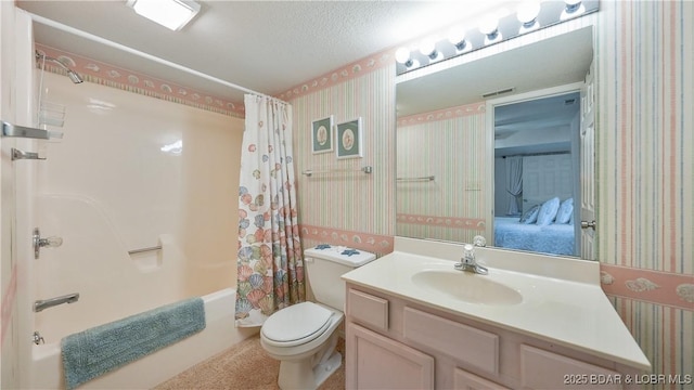 ensuite bathroom featuring wallpapered walls, toilet, ensuite bathroom, shower / bath combo with shower curtain, and vanity