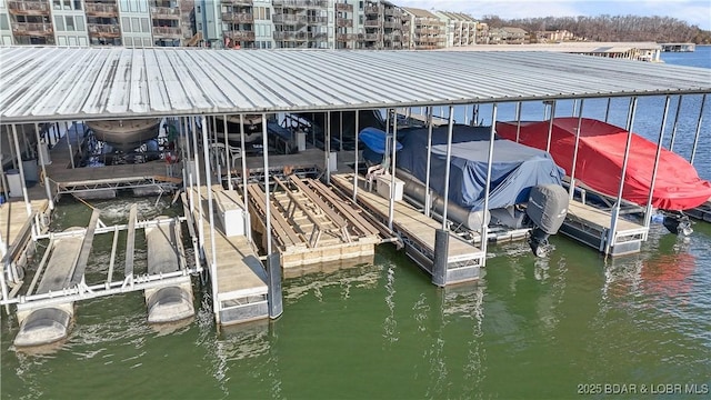 dock area featuring a water view and boat lift