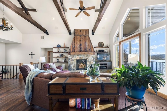 175 Black Rock Rd, Camdenton, MO 65020 - living room featuring wood finished floors, ceiling fan, a fireplace, beam ceiling, and high vaulted ceiling