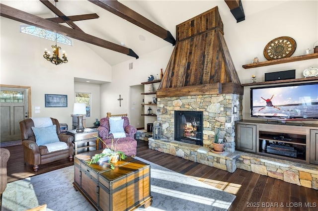 living room with a chandelier, high vaulted ceiling, a stone fireplace, light wood-style flooring, and beam ceiling