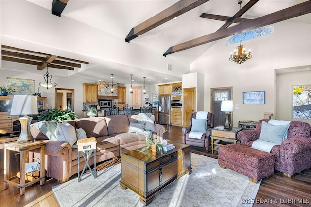 living area featuring visible vents, dark wood-type flooring, an inviting chandelier, high vaulted ceiling, and beam ceiling