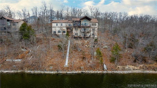 back of house with a water view