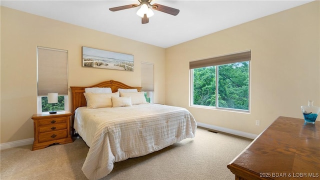 bedroom featuring carpet, visible vents, and baseboards