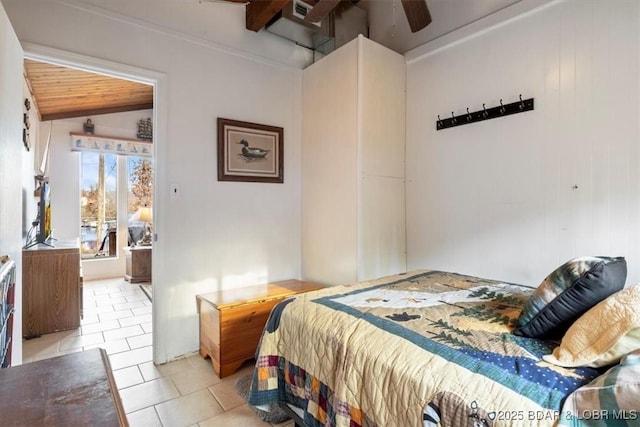 bedroom with ceiling fan, vaulted ceiling, and light tile patterned floors