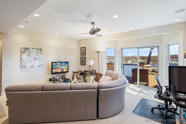 living room featuring ceiling fan and recessed lighting