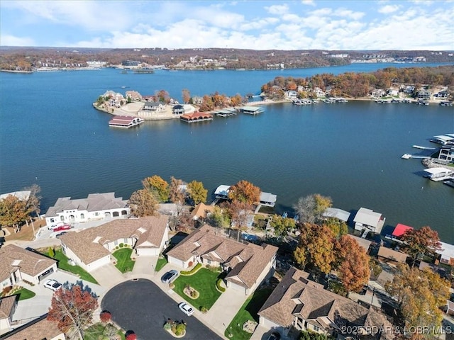 birds eye view of property with a residential view and a water view