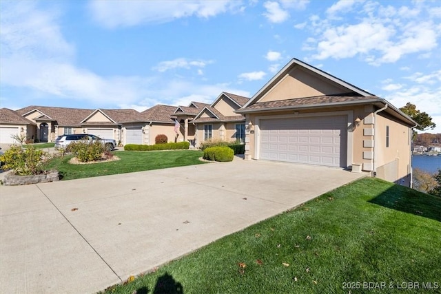 view of front of house with a garage, concrete driveway, a front yard, and stucco siding