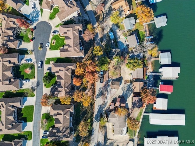 aerial view featuring a water view and a residential view