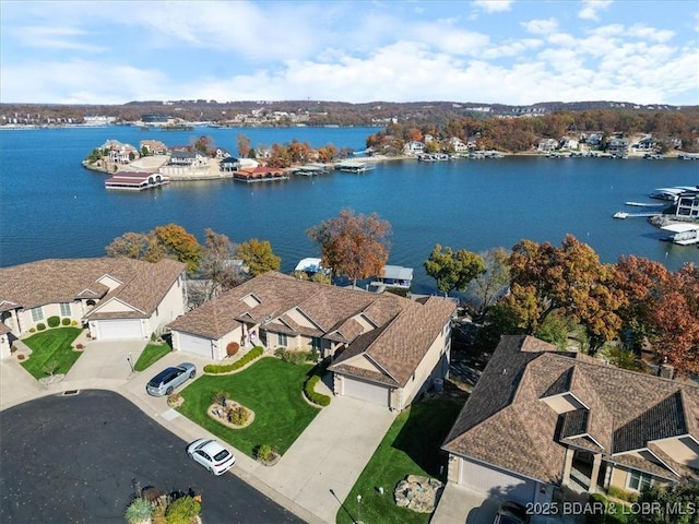 birds eye view of property featuring a residential view and a water view