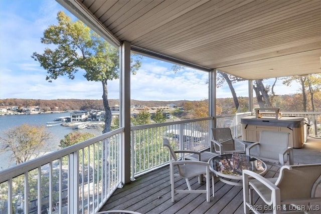 wooden deck with a water view