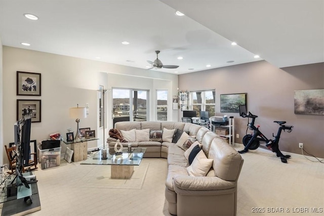 living area featuring recessed lighting, light carpet, ceiling fan, and baseboards