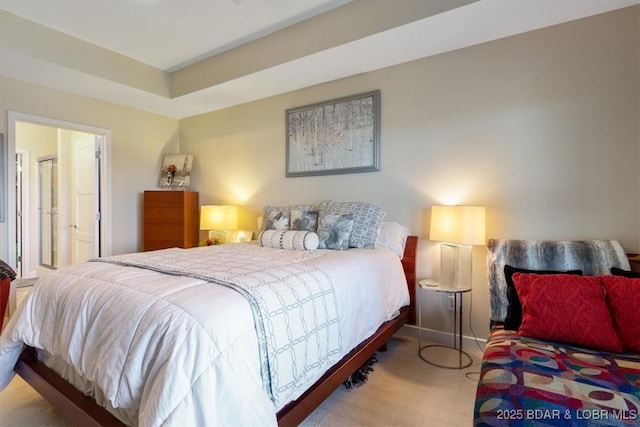 bedroom featuring baseboards and light floors