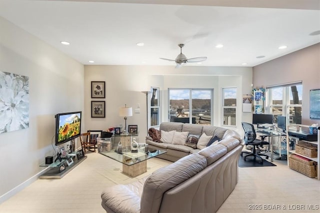 living room with light carpet, ceiling fan, baseboards, and recessed lighting