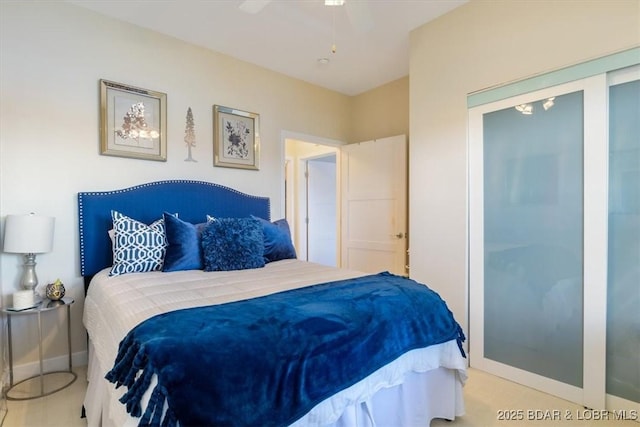 bedroom featuring a ceiling fan and baseboards