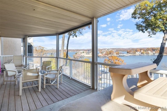 wooden deck featuring a water view