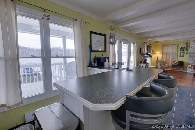 kitchen featuring beam ceiling