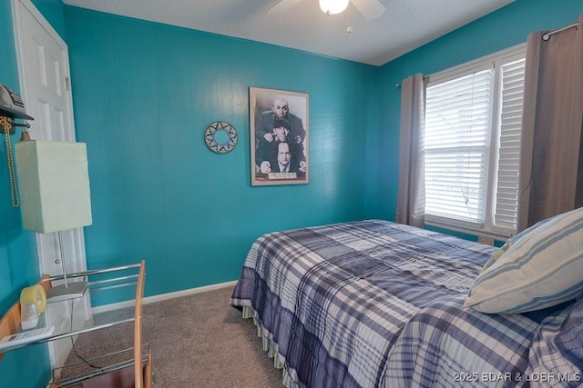 bedroom featuring carpet floors, baseboards, and a ceiling fan