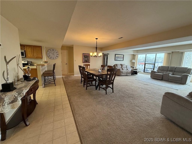 85 La Jolla Dr Unit 352-2A, Lake Ozark, MO 65049 - dining room featuring a chandelier and baseboards