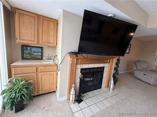 85 La Jolla Dr Unit 352-2A, Lake Ozark, MO 65049 - living area featuring light carpet, baseboards, and a fireplace