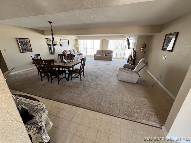85 La Jolla Dr Unit 352-2A, Lake Ozark, MO 65049 - carpeted dining space with baseboards and a textured ceiling