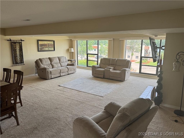 85 La Jolla Dr Unit 352-2A, Lake Ozark, MO 65049 - living room featuring carpet flooring and baseboards