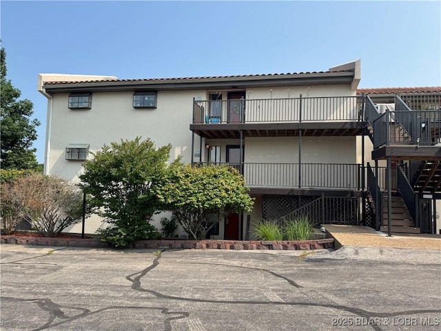 85 La Jolla Dr Unit 352-2A, Lake Ozark, MO 65049 - view of property featuring stairway and cooling unit
