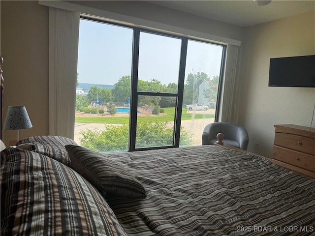 85 La Jolla Dr Unit 352-2A, Lake Ozark, MO 65049 - bedroom featuring multiple windows