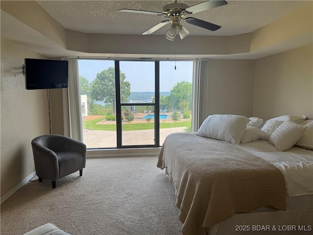 85 La Jolla Dr Unit 352-2A, Lake Ozark, MO 65049 - carpeted bedroom featuring a textured ceiling, baseboards, and ceiling fan
